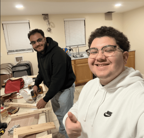 Michael Beshay and Peter Kalds working together in the workshop on the wheelchair project