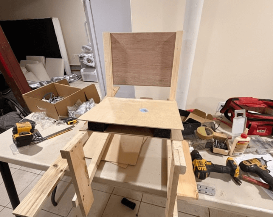 Workshop overview showing tools, materials, and work in progress during the wheelchair build