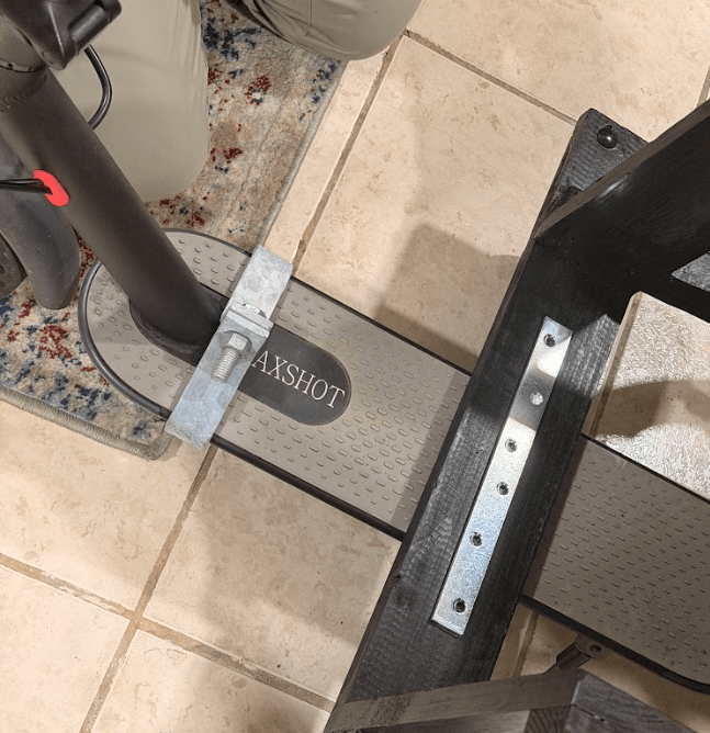 CAD detail view of the scooter attachment mechanism showing the clamp system connection point